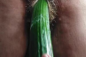blonde granny fucks her old hairy pussy with a big cucumber!