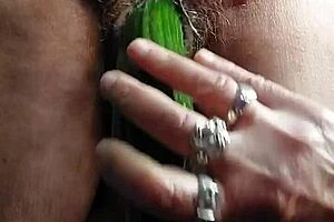 blonde granny fucks her old hairy pussy with a big cucumber!