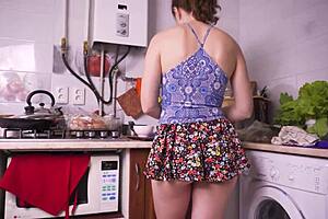 a hot stepsis teases with upskirt views while cooking in the kitchen