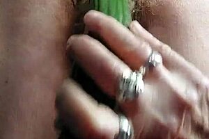 blonde granny fucks her old hairy pussy with a big cucumber!