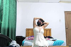 the busty executive picks a white dress and starts sensual moves showing her beautiful vagina