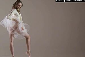 blonde gymnast stretches and performs in the gym
