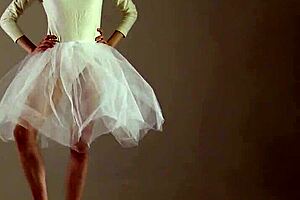 blonde gymnast stretches and performs in the gym