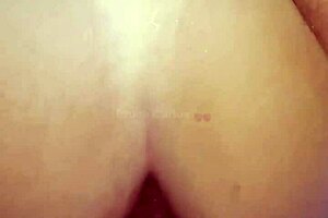 She gets fucked in pussy and ass by big cock, moaning loudly.