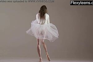 blonde gymnast stretches and performs in the gym