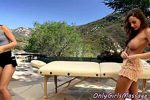 The masseuse seduces a busty babe in an outdoor fantasy