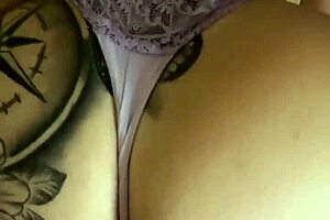 beautiful latina couple enjoys homemade massage in bedroom