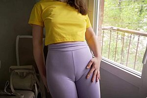 in the gym, a girl in tight leggings shows off