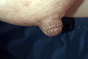 intriguing close-up of nipple on piano keys in detailed view