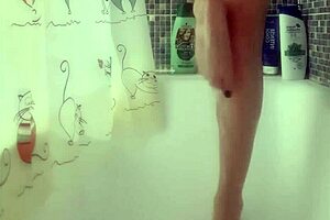 Why is that busty babe washing her feet in the shower?