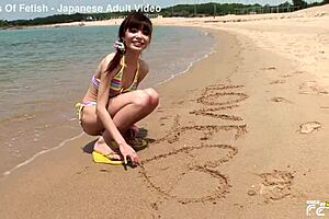 skinny japanese chick enjoys having a photoshoot on the beach