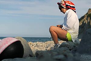 Pretty Babe Flashes Tits and Gives Handjob to Stranger on Beach