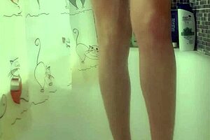 Why is that busty babe washing her feet in the shower?