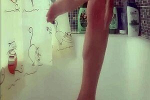 Why is that busty babe washing her feet in the shower?