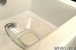 The scene features an individual urinating and engaging in drilling motions in an intimate area of the body