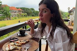 Eating Pizza With Sauce On Face In Public Cafe