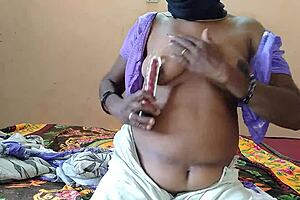 Girl Inserts Vibrator in Pussy on Bed