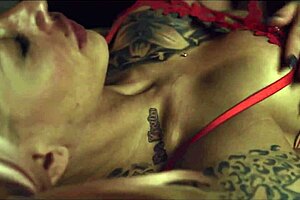 two tattooed girls having fun with toys