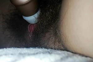 Hairy pussy close-up: quick bed masturbation builds to big clit orgasm and intense cumming