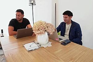 Employee interacts with two students in a professional setting