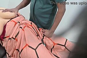 Indian Doctor Thoroughly Checking Lady Patient In Clinic