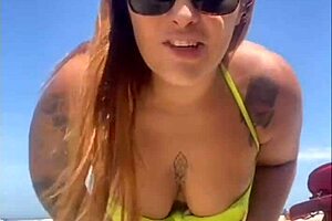 African woman flashes big pussy on beach