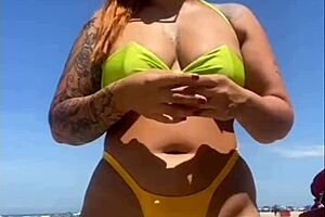 African woman flashes big pussy on beach