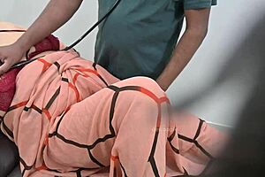 Indian Doctor Thoroughly Checking Lady Patient In Clinic