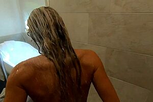 Curvy blonde milf bathing in shower spied by husbands friend