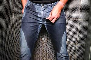 Guy pees inside his jeans and delivers a cumshot on the end!