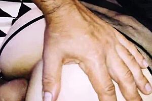 A wife in erotic fishnet spreads legs beautifully