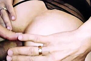 A wife in erotic fishnet spreads legs beautifully