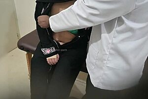 Hey, that doctor is thoroughly checking out the hijab lady's boobs in the hospital, feeling the excitement