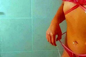 Tanned Latina beauties rinse off beach sand in steamy shower