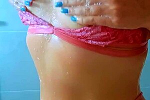 Tanned Latina beauties rinse off beach sand in steamy shower