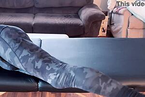 bodybuilder stretches leggings on massage table in hd fetish workout