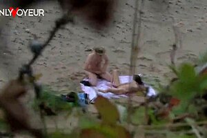 Beach voyeur couple strokes each other to passionate cumshots