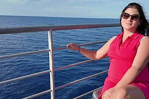 Curvy brunette flashes big tits and pussy publicly on beach