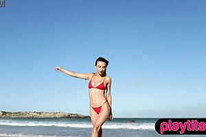 petite asian milf and ukrainian brunette bombshell undress at beach