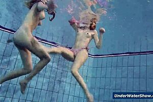 Horny Czech blondes rip bikinis and strip nude in pool underwater