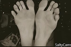 Teasing foot lover indulges in gentle toe worship