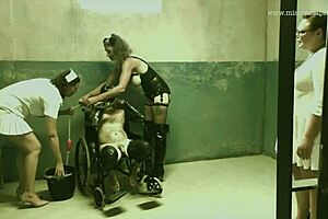 Dominatrix mistress April brutally strapons bound slaves in military camp