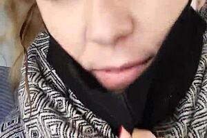 A flirty babe teases riders on the crowded train.