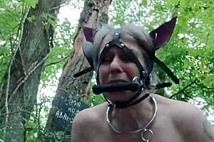 Ponygirl Slave Bent Over in Forest Takes Buttplug and Doggystyle Pounding!
