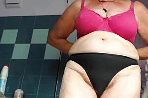 granny stuffs hairy pussy with thick cucumber