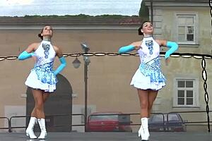 Cheerleader majorettes tempt with their perky assets up close