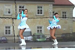 Cheerleader majorettes tempt with their perky assets up close