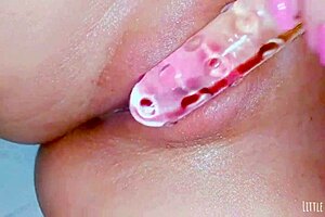 Horny Spa Girl Impales Shaved Pussy on Glass Dildo