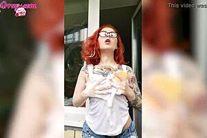 Sexy redhead teen babe soaks her big tits in wet t-shirt while horny window washing homemade.