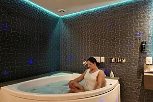 soaking wet in the tub fooling around with hubby's friend while he works 😏💦